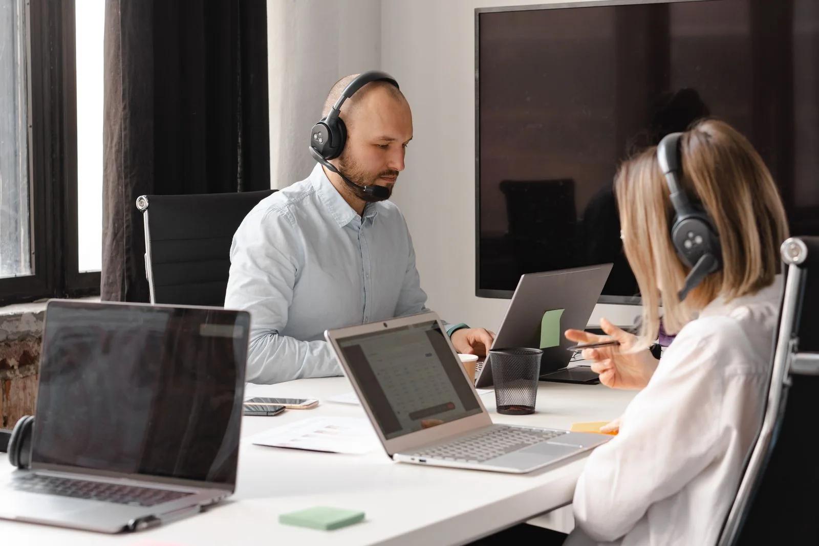 Business IT support team working from a shared help desk